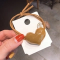Brown elastic hair tie with a faceted resin heart charm and a silver Cool tag - Light Coffee
