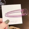 Pince à cheveux violette transparente couleur bonbon sur une carte de produit - Petit Violet