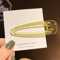 Pince à cheveux bec de canard jaune transparente sur carte d'affichage pour la coiffure - Petit Jaune