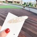 Translucent resin hair clip with iridescent shell flakes on a display card - Oval White