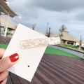 Minimalist shell pattern hair clip with iridescent resin finish on display card - Square White