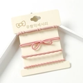 Set of 4 elastic hair ties in dusty rose pink featuring knotted and bow designs - Pink