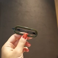 Elegant olive green oval hollow hair clip with minimalist glossy finish for women - Green