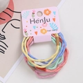 Elastic braided hair ties in colorful pastel macaron tones on a branded display card - Style 1