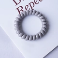 Minimalist grey spiral telephone wire hair tie in a macaron shade for a ponytail - Premium Grey