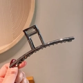 Minimalist long gunmetal gray shark hair claw clip held by hand for elegant hair styling - 4-Gunmetal Rectangular Clip
