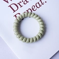 Minimalist spiral telephone cord hair tie in light macaron green color with elasticity - Matcha Green