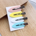 Set of four colorful seamless hair clips in pink, yellow, white, and blue on card - Mixed Blue