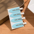 Set of 4 sky blue seamless hair clips with silver duckbill pins on a white card - Blue