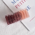 Spiral telephone cord hair ties in coffee and peach colors stored in a TPU box - Caramel Gradient