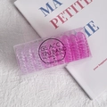 Pink and purple gradient spiral hair ties in a transparent box on a stylish background - Pink Gradient