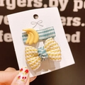 Cute yellow banana and plaid bow hair clip set for kids on white card display - Banana