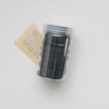 Elastic black hair ties set in a transparent storage jar for durable daily hair styling - Black