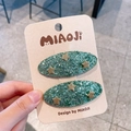 Par de pinzas verdes con lentejuelas y estrellas doradas para el pelo de niñas - Verde Lago