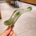 Matte green wave-shaped large hair claw clip held by hand for minimalist styling - Wavy Curve (4-Green) / Green
