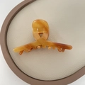 Classic amber acetate claw clip with a tortoiseshell marble texture for elegant hair styling - Light Coffee