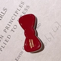 Handmade red acetate bow hair clip with gold France lettering on vintage paper - Red