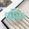 French style acetate claw clip with mint green and yellow stripes and heart cutout - Creamy Blue
