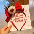 Detail of red velvet bow headband with reindeer antlers and plush pompom for Christmas - 6-Heart Bow Headband