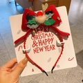 Detail of Christmas headband with red bow, glitter reindeer antlers and holly leaves - 7-Pom Bell Headband