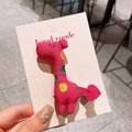 Handmade rose red dinosaur hair clip with colorful embroidery on card display - Pink Giraffe