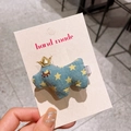 Cute dark blue plush rabbit hair clip with yellow stars and golden crown detail - Crown Dog