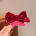 Elegant burgundy velvet hair bow clip with pearls and rhinestones on a display card - Burgundy Rhinestone Pearl Bow