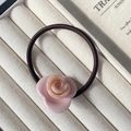 Pink rose acetate hair tie with high-elastic brown braided rope on jewelry box - Rose Pink