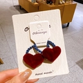 Pair of deep red velvet heart-shaped hair ties with navy elastic on a white card - Wave Ring Red Heart