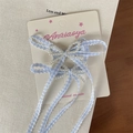 Haarklammer mit blau-weißem Karomuster, weißen Perlen und langen Quasten-Details - Haarclip / Blau