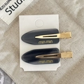 Elegante set di due fermagli per capelli neri in acetato con scritta dorata min min e metallo - Grigio