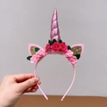 Einhorn Haarreif in Rosa mit glänzendem Horn und Stoffrosen für Kinderpartys - Rosa Blume