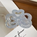 Iridescent light blue acetate hair claw clip with hollow bow design and gold spring - Iridescent Blue