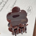 Brown flower-shaped hair claw clip in a glossy finish with golden handmade lettering - Dark Coffee