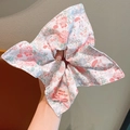 Floral scrunchie with bunny and mushroom prints, featuring a cute bow and fabric label - Pink Floral