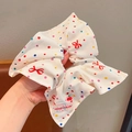 Polka dot fabric scrunchie with red bow pattern and cherry charm accessory - Polka Dot Bow