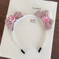 Cerchietto bianco con grandi fiocchi di raso rosa e ciondoli in resina a forma di unicorno - Rosa