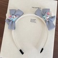 Cerchietto bianco carino con fiocchi grigi e ciondoli a unicorno colorati per bambine - Blu