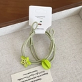 Elastic green hair tie set with starfruit pendant on decorative display card - Green