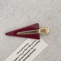 Elegant deep red triangular acetate hair clip with a polished finish and golden metal clip - Burgundy