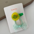 Cute girls' hair accessories set featuring a green mesh bow and a yellow smiley face clip - Smiley Face