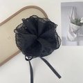 Detail of elegant black lace hair scrunchie with ribbons on a minimalist white backdrop - Black Scrunchie with Ribbon Tassel