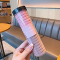 Set di elastici per capelli rosa e beige in un flacone trasparente per bambine - Rosa