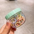 Colorful macaron kids hair ties set in a transparent storage jar with mint green lid - Macaron Color