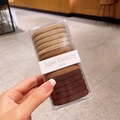 Elastic seamless hair ties set in earthy gradient tones inside a transparent storage box - Brown