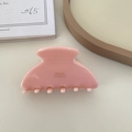 Elegant mauve acetate hair claw clip with golden brand logo on minimalist background - Milky Pink