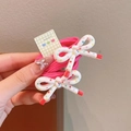 Pink elastic hair ties with white printed bows and Serendipity gold lettering - Red