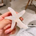 Pasador de estrella de mar en acetato blanco crema con acabado perlado elegante - Color Sirena Nacarado