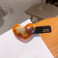 Elegant amber heart hair clip with tortoiseshell pattern on a black duckbill clip - 6-Milk Coffee