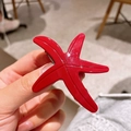 Barrette étoile de mer en acétate rouge vif avec finition brillante et pince en métal - Rouge